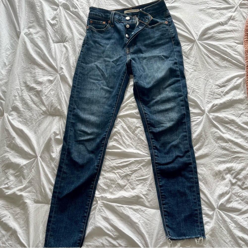 Levi high waisted skinny jean, medium/dark wash, very lightly warn, size 26